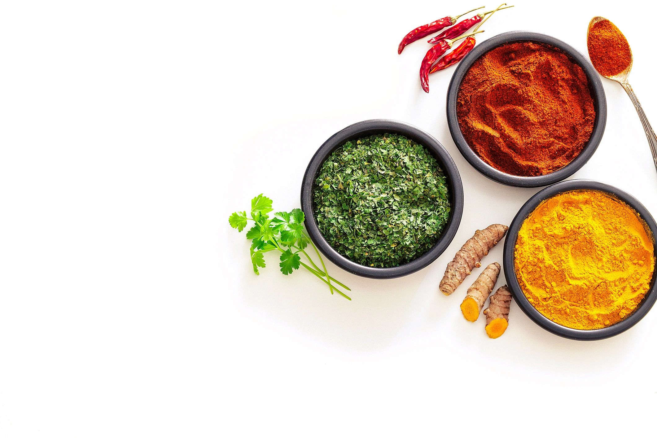 Turmeric and spice powders in bowls