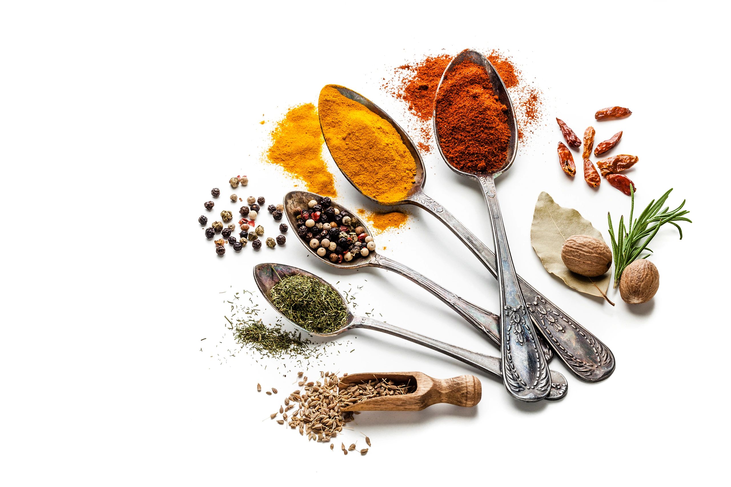 Assorted spices displayed in spoons